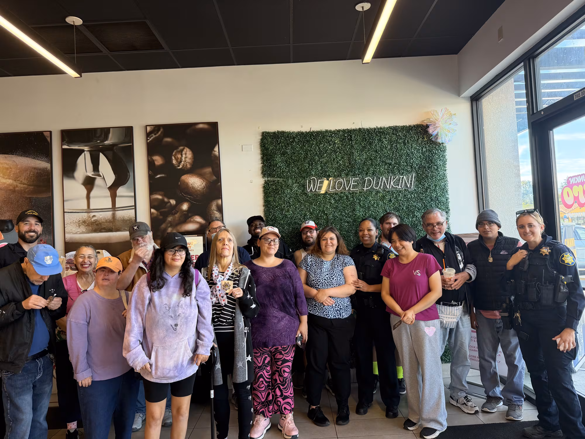 Compass participants and staff gathered together at a local cafe